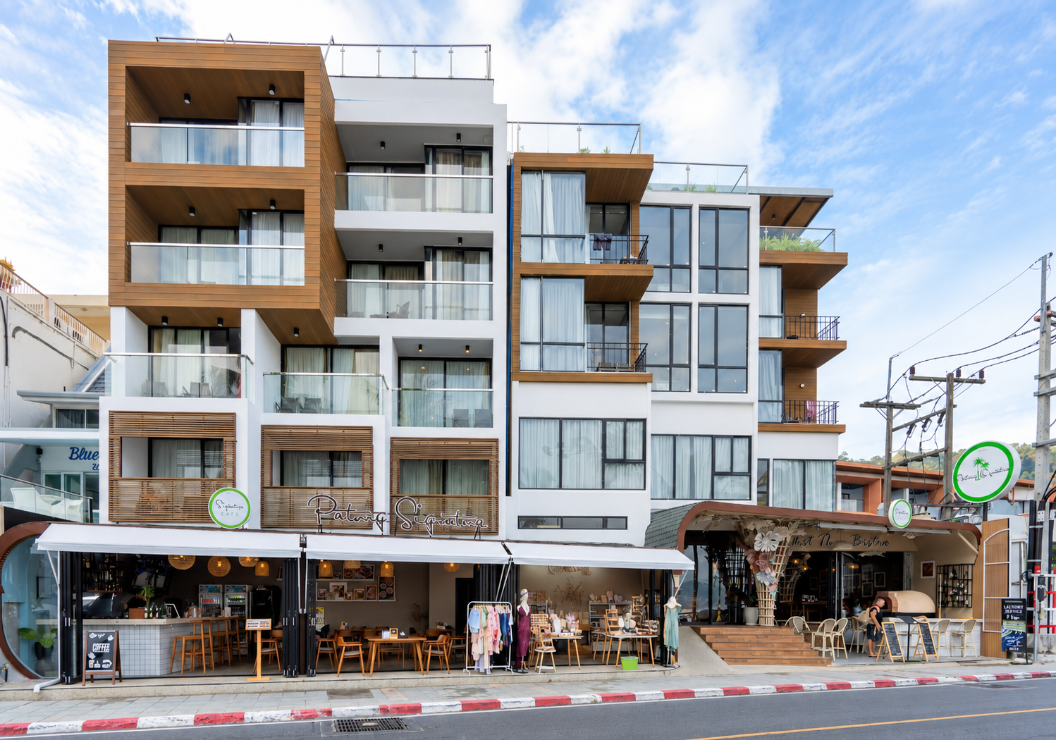 Sunlit exterior of Patong Signature Boutique Hotel and Phuket Thai Bistro