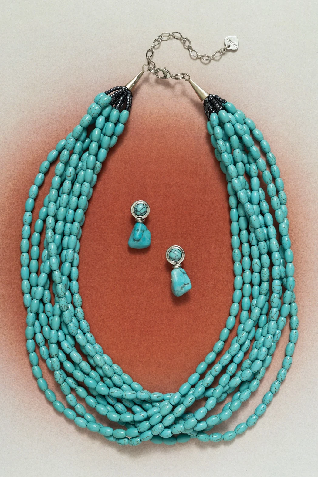 Layered blue beaded necklace with coordinating earrings