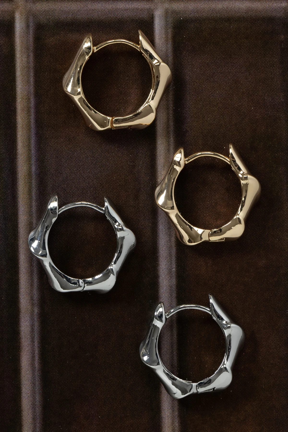 Gold-tone and silver-tone sculptural hoop earrings