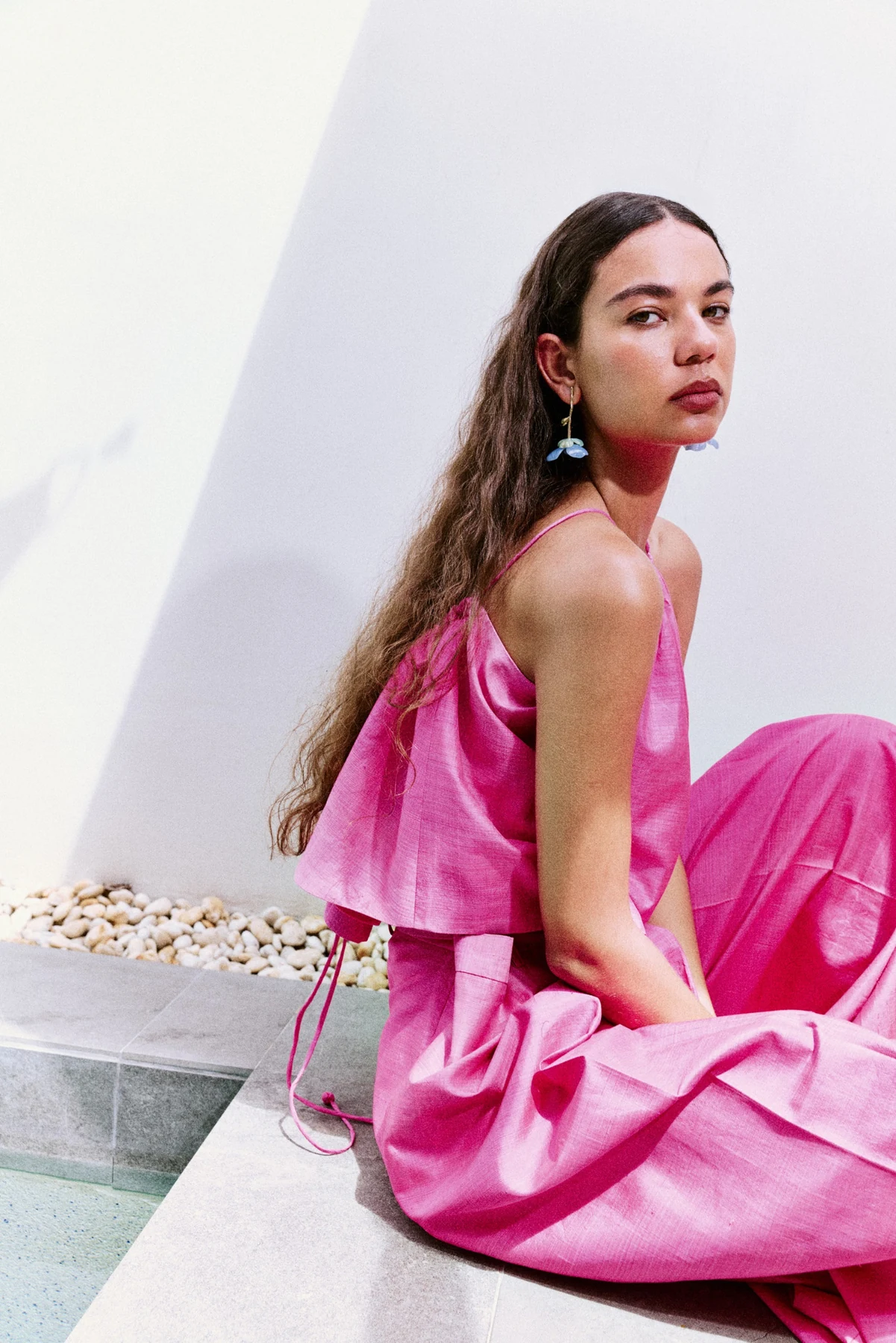 Nakamol earrings styled with a bright pink dress